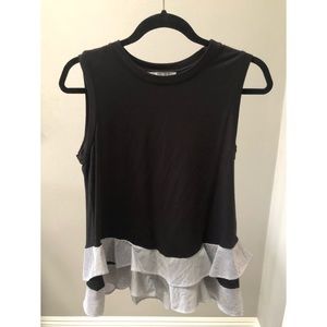 Black blouse with striped ruffled bottom